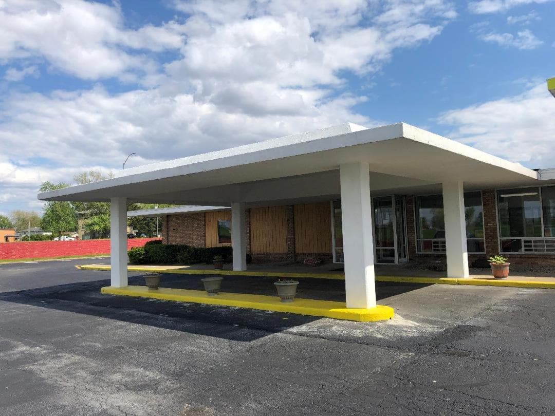 Regal 8 Inn & Suites featured exterior or lobby in Lincoln, IL — similar hotel