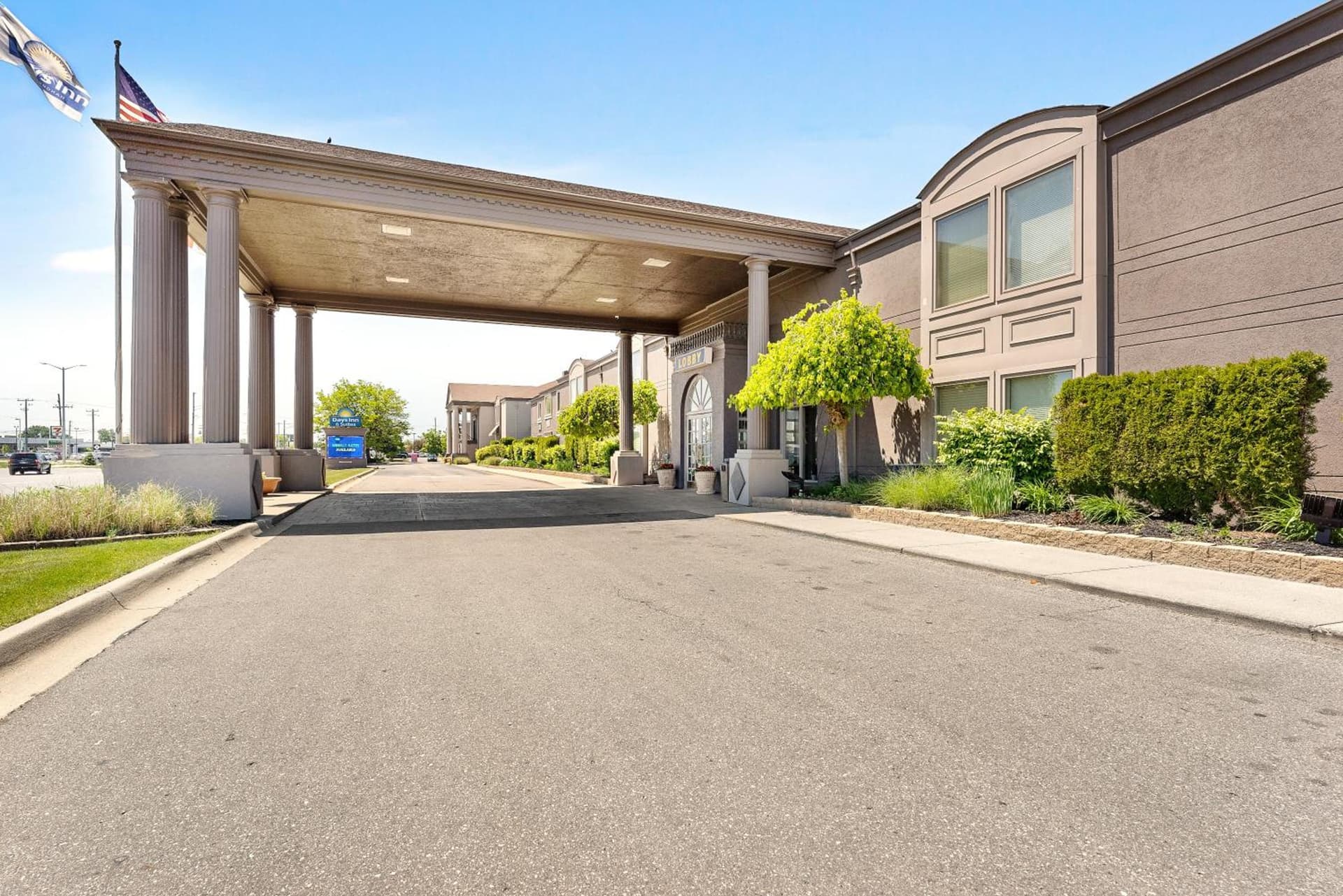 Days Inn & Suites by Wyndham Roseville/Detroit Area featured exterior or lobby in Roseville, MI — similar hotel
