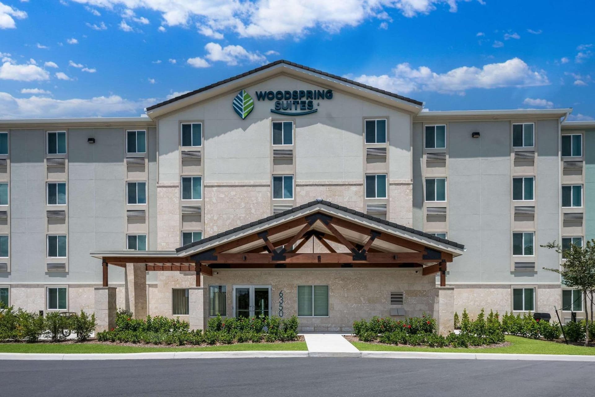 WoodSpring Suites West Palm Beach featured exterior or lobby in West Palm Beach, FL — similar hotel