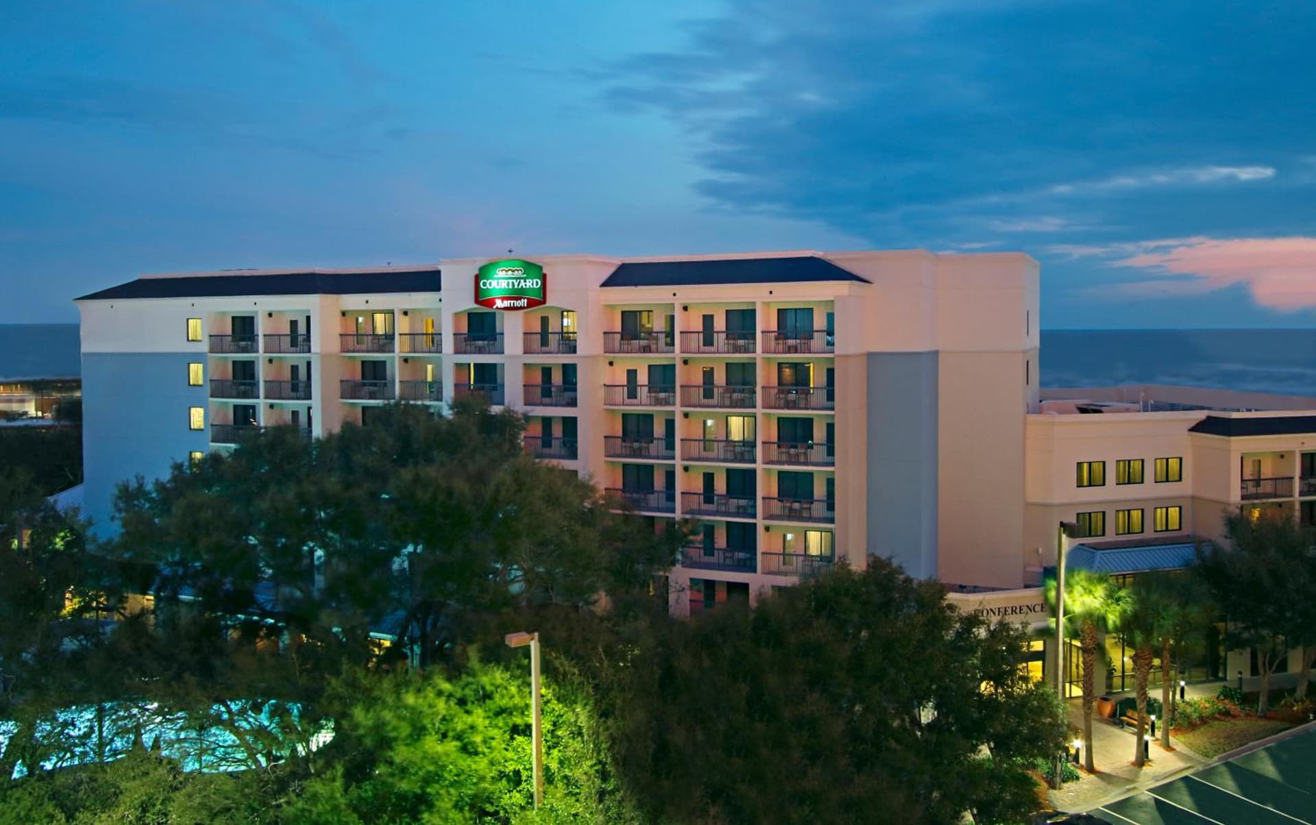 Courtyard by Marriott Cocoa Beach Cape Canaveral featured exterior or lobby in Cocoa Beach, FL — similar hotel