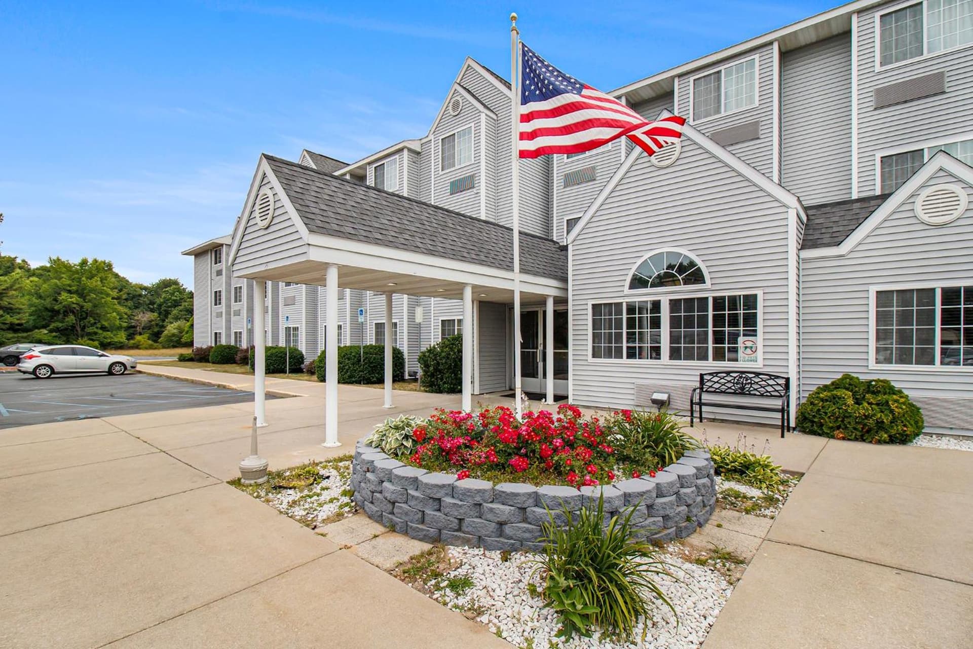 Microtel Inn and Suites Manistee featured exterior or lobby in Manistee, MI — similar hotel