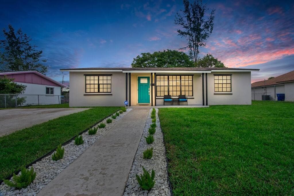 Modern getaway near the beach with room for a boat featured exterior or lobby in West Palm Beach, FL — similar hotel