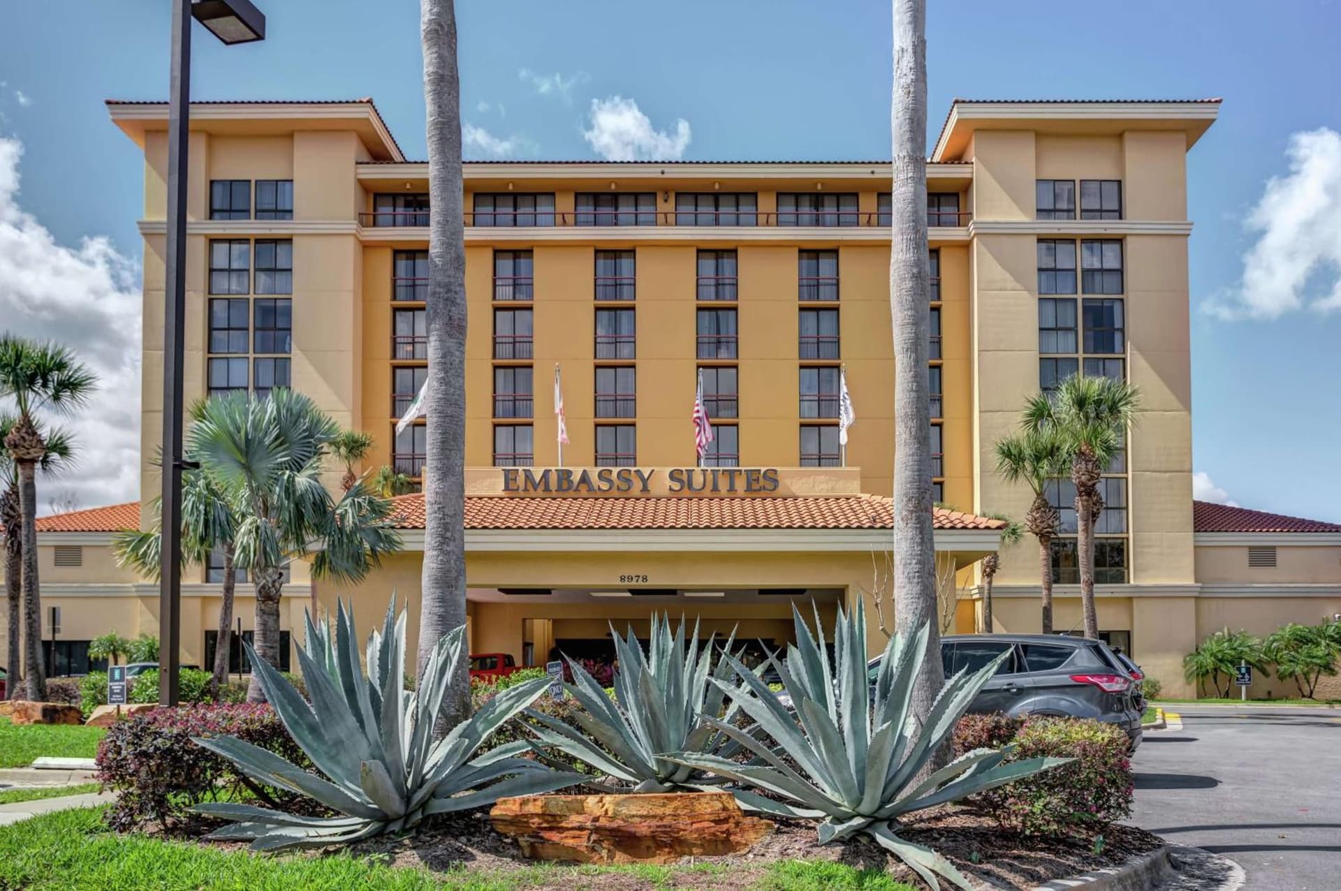 Embassy Suites by Hilton Orlando International Drive Convention Center featured exterior or lobby in Orlando, FL — similar hotel