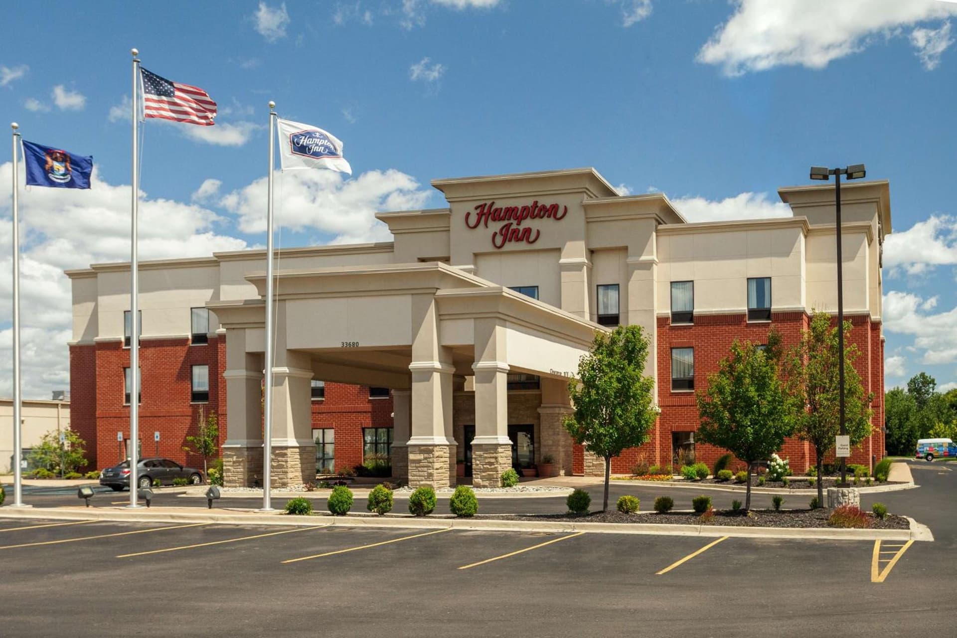 Hampton Inn Detroit Roseville featured exterior or lobby in Clinton — similar hotel