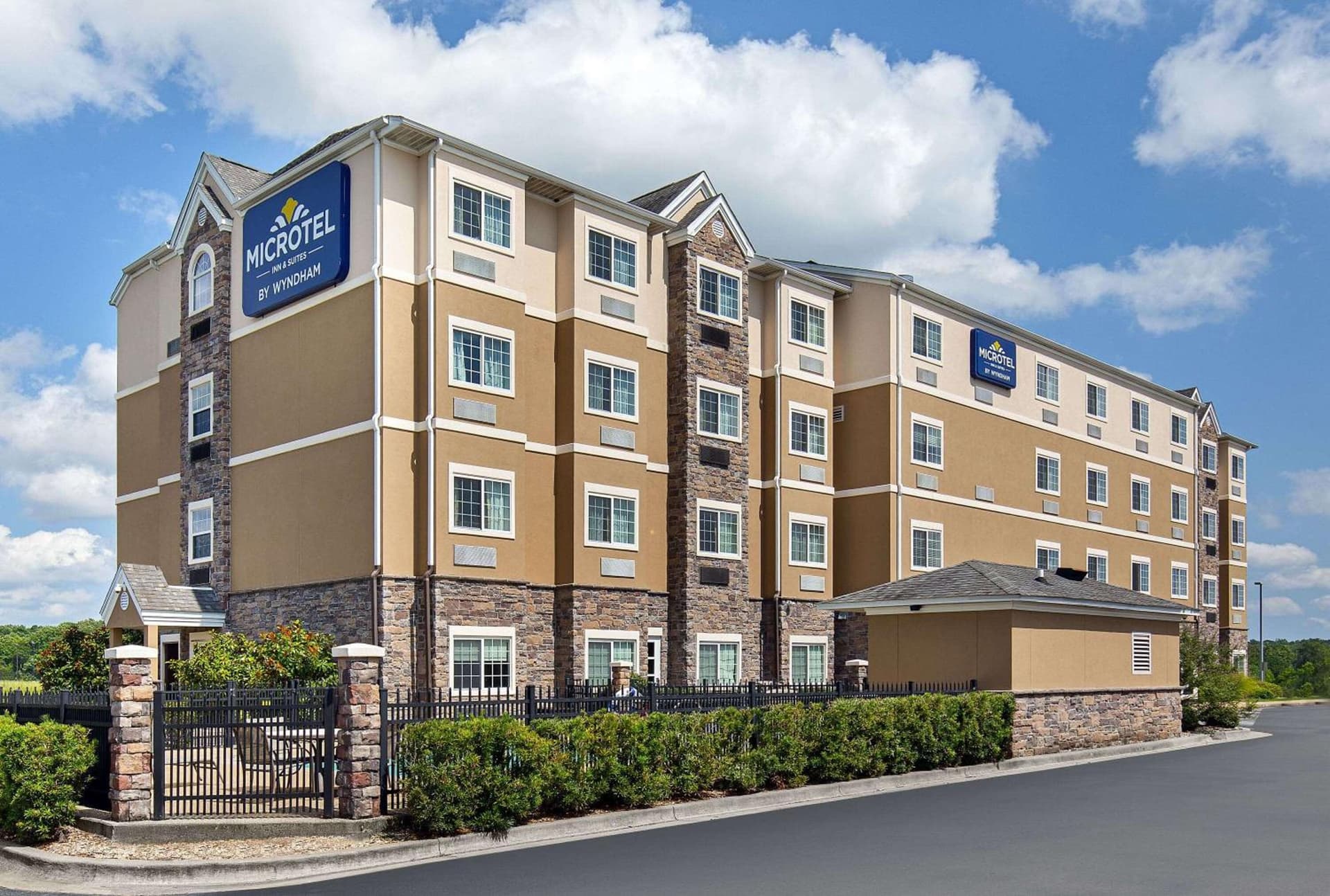 Microtel Inn and Suites by Wyndham featured exterior or lobby in Opelika, AL — similar hotel