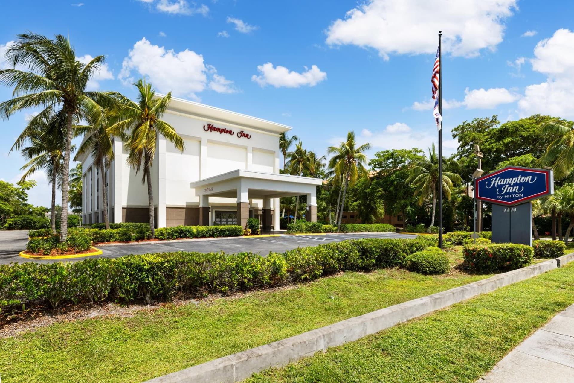 Hampton Inn Naples-Central featured exterior or lobby in Naples, FL — similar hotel