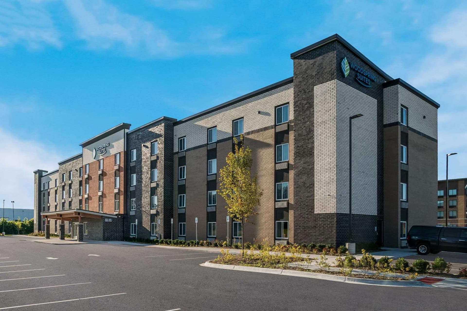 WoodSpring Suites Detroit Sterling Heights featured exterior or lobby in Sterling Heights, MI — similar hotel