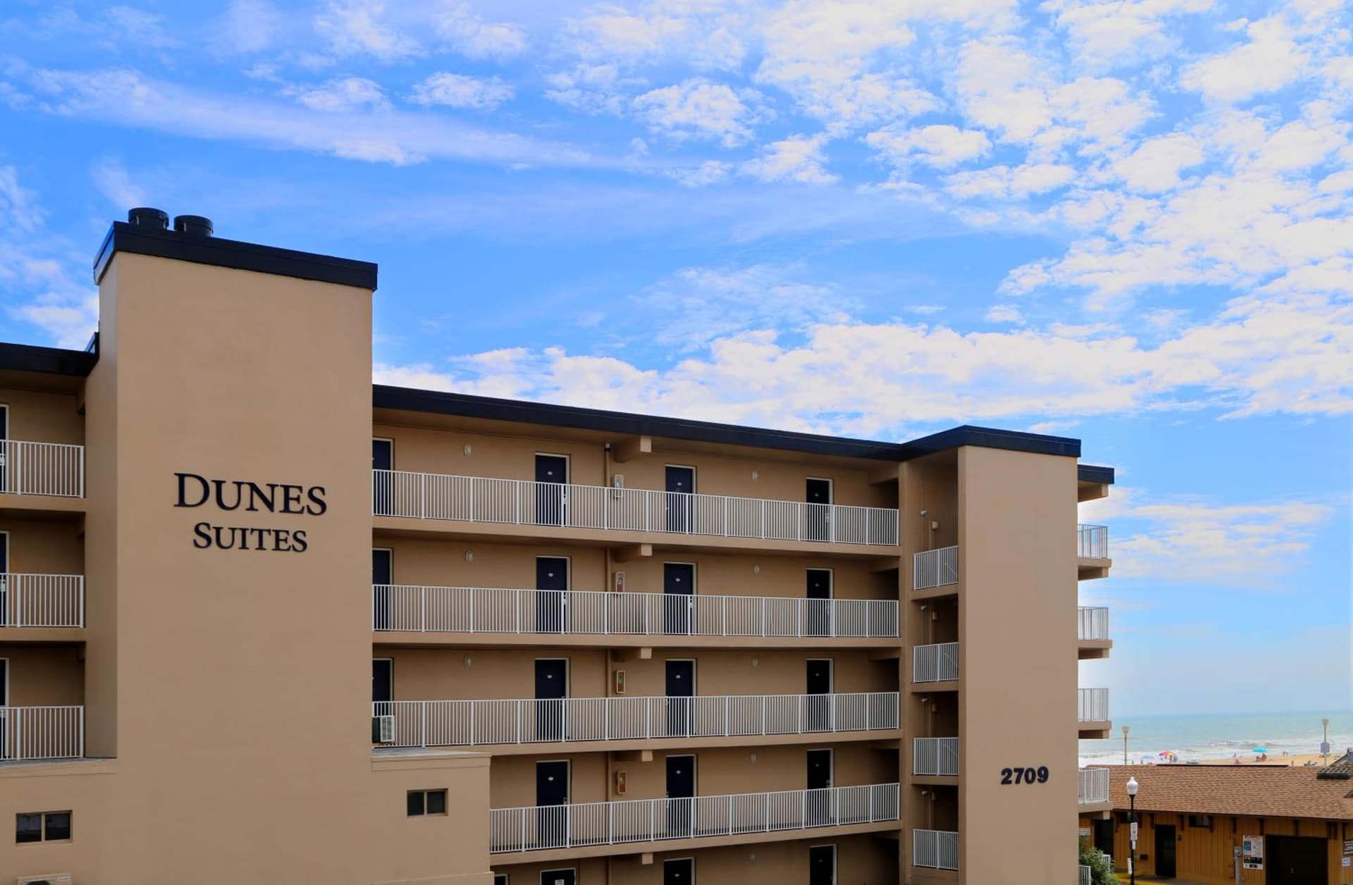 Dunes Suites Oceanfront featured exterior or lobby in Ocean City, MD — similar hotel