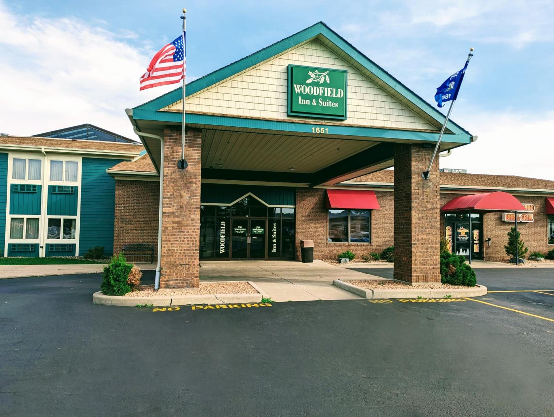 Woodfield Inn and Suites featured exterior or lobby in Marshfield, WI — similar hotel