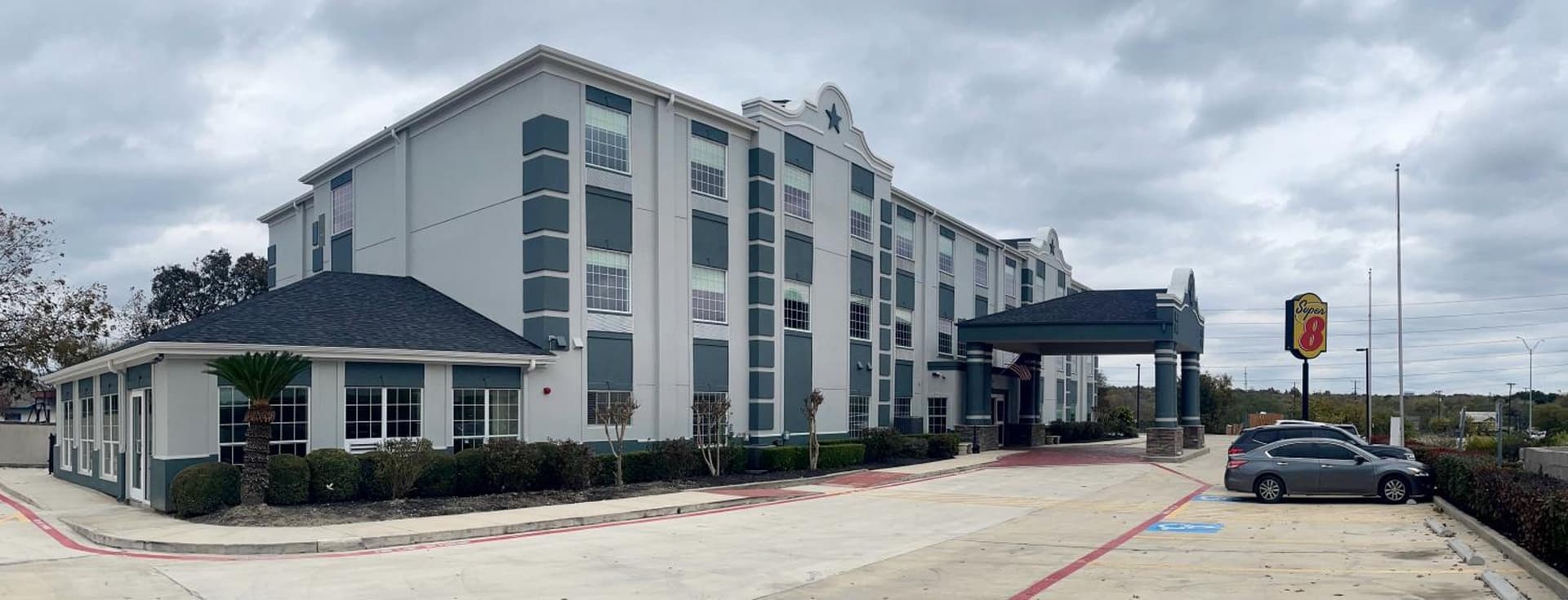 Super 8 by Wyndham San Antonio/Alamodome Area featured exterior or lobby in San Antonio, TX — similar hotel