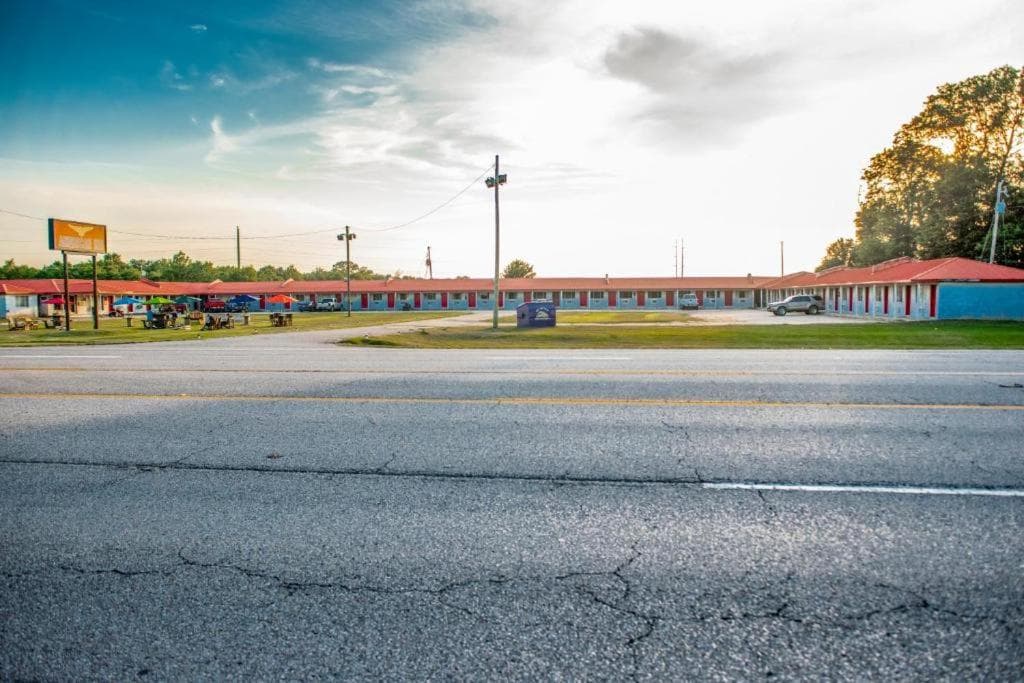 American Inn featured exterior or lobby in Dermott, AR — similar hotel