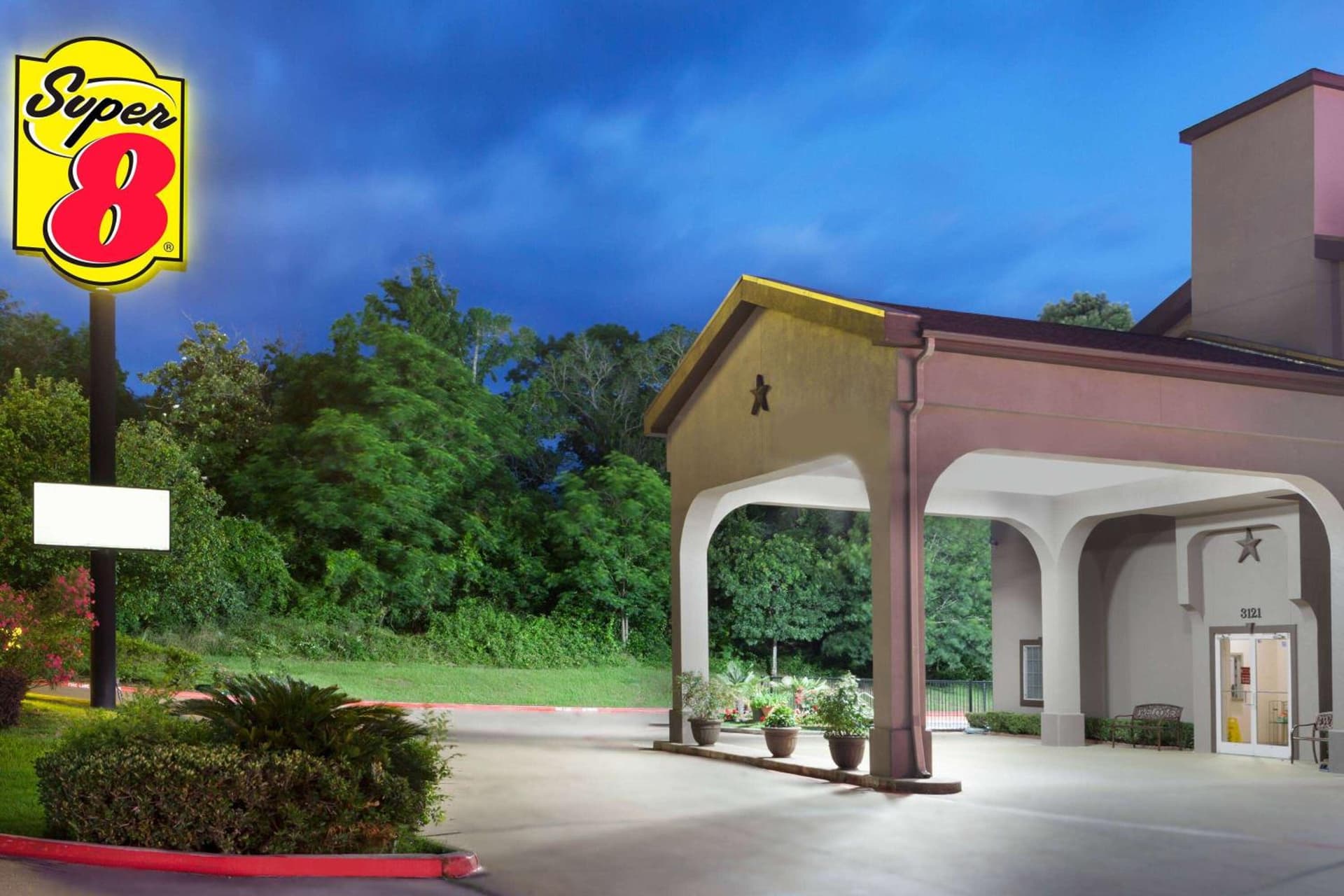 Super 8 by Wyndham Huntsville featured exterior or lobby in Huntsville, TX — similar hotel