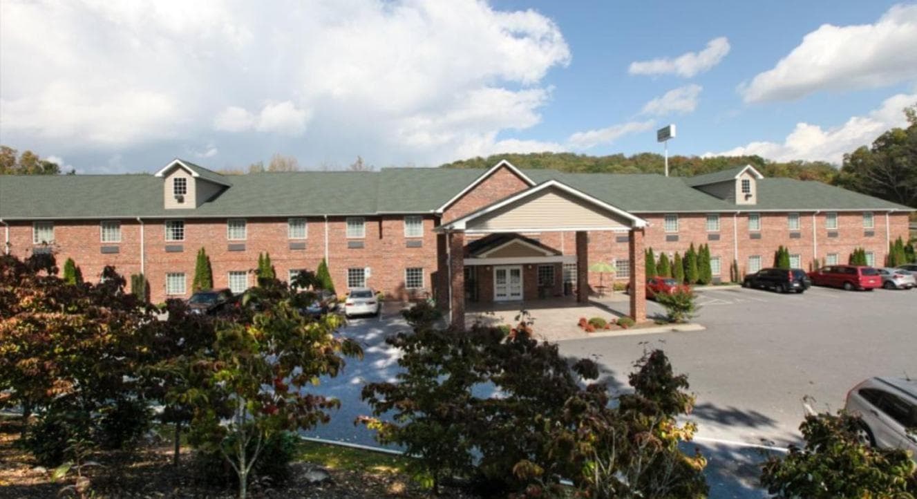 Mountain Inn & Suites Airport - Hendersonville featured exterior or lobby in Hendersonville, NC — similar hotel