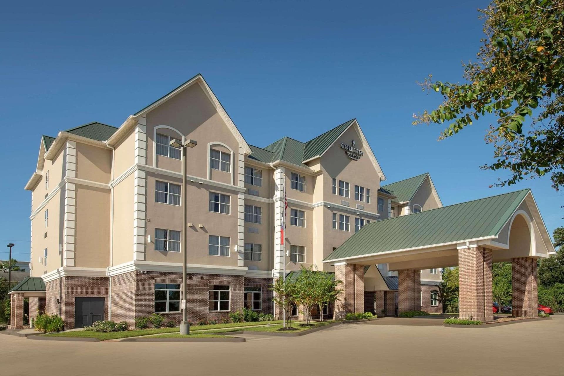 Country Inn & Suites by Radisson, Humble IAH East featured exterior or lobby in Humble, TX — similar hotel
