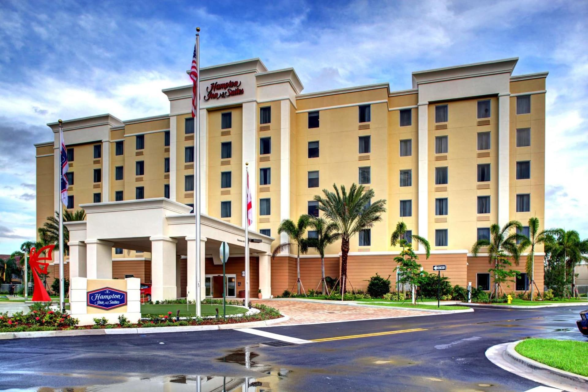 Hampton Inn and Suites Coconut Creek exterior or lobby in West Dixie Bend, FL — main listing photo