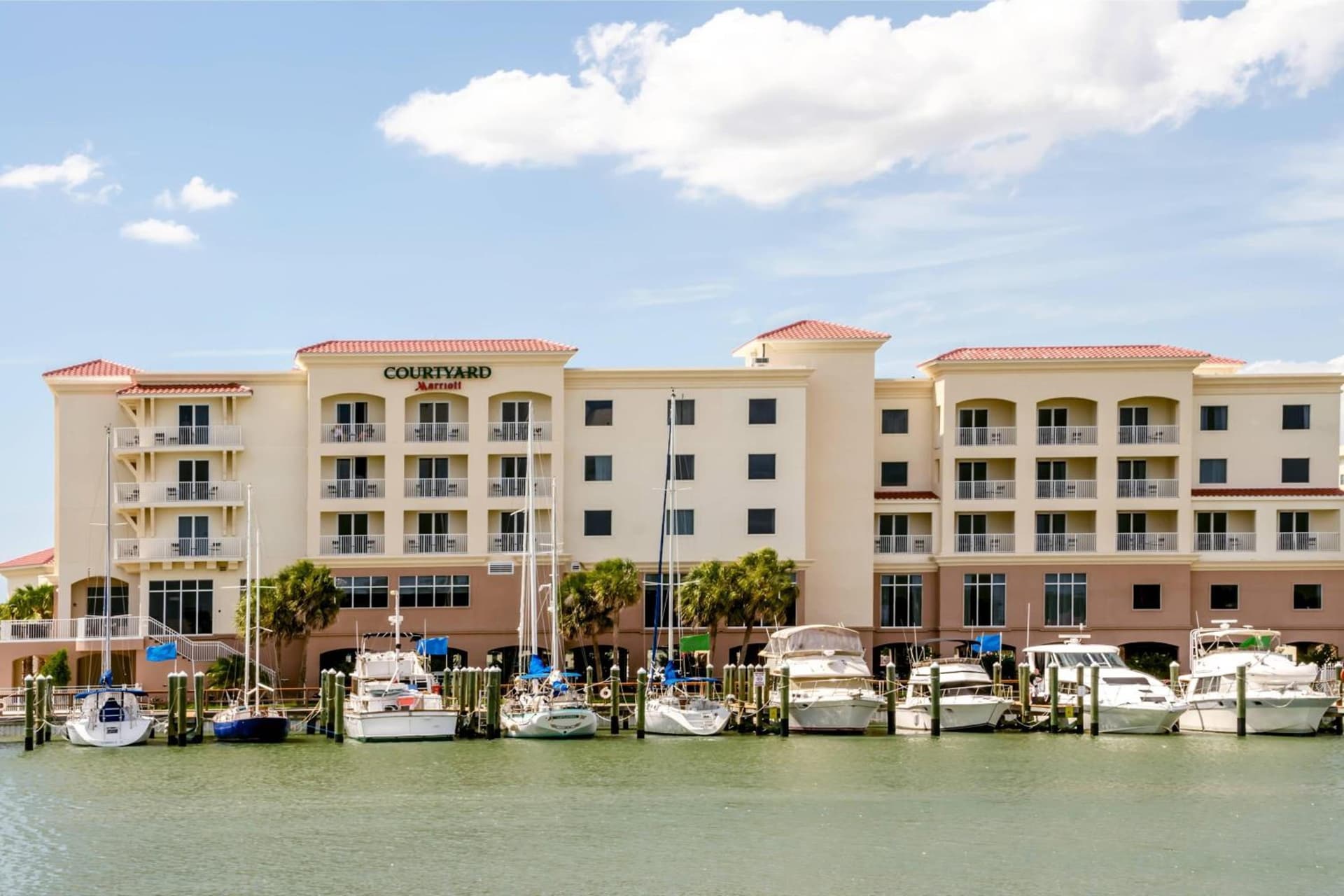 Courtyard by Marriott St. Petersburg Clearwater/Madeira Beach exterior or lobby in St Pete Beach, FL — main listing photo