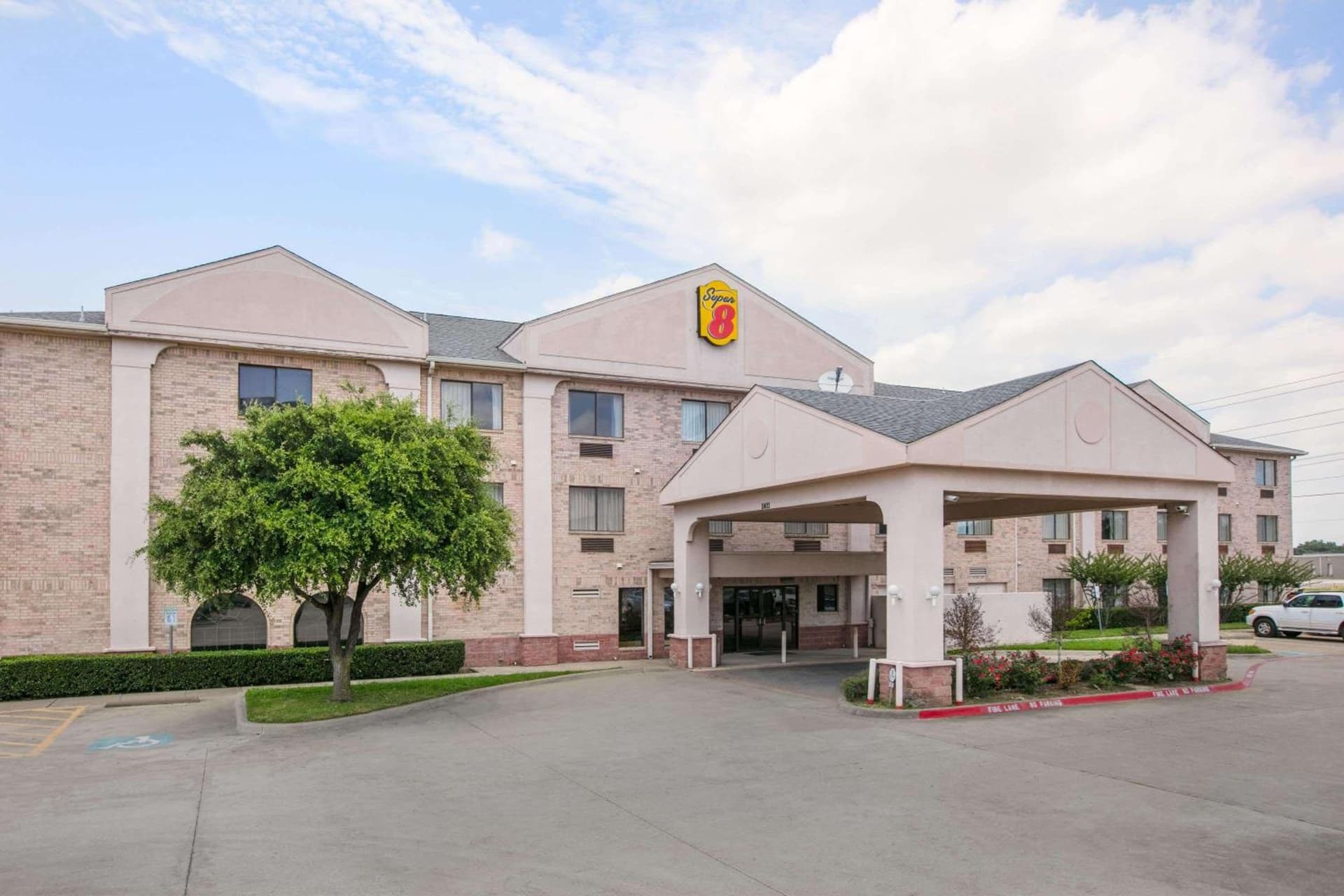Super 8 by Wyndham Garland North Dallas Area exterior or lobby in Garland, TX — main listing photo