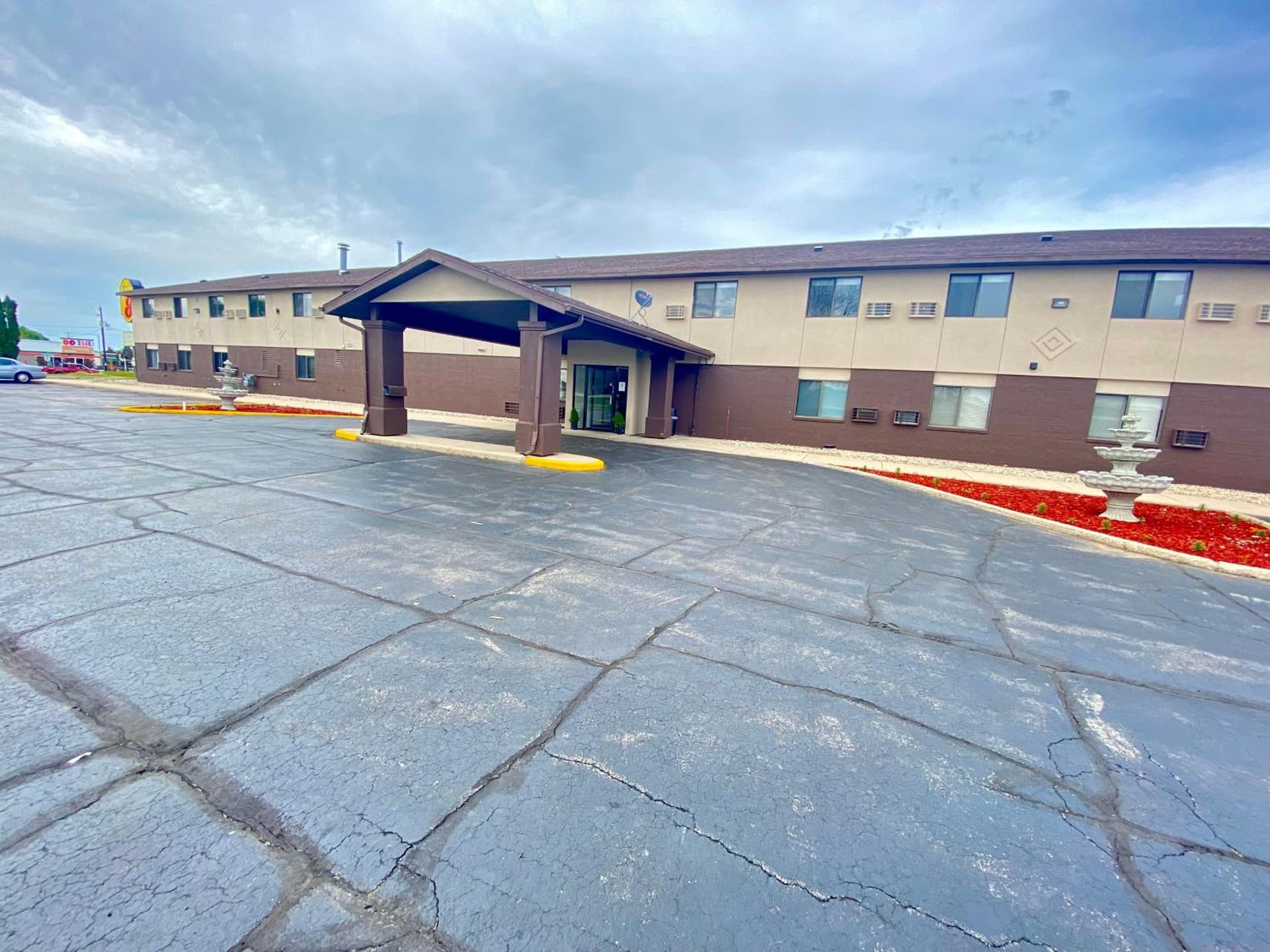 Super 8 by Wyndham Oshkosh Airport featured exterior or lobby in Oshkosh, WI — similar hotel