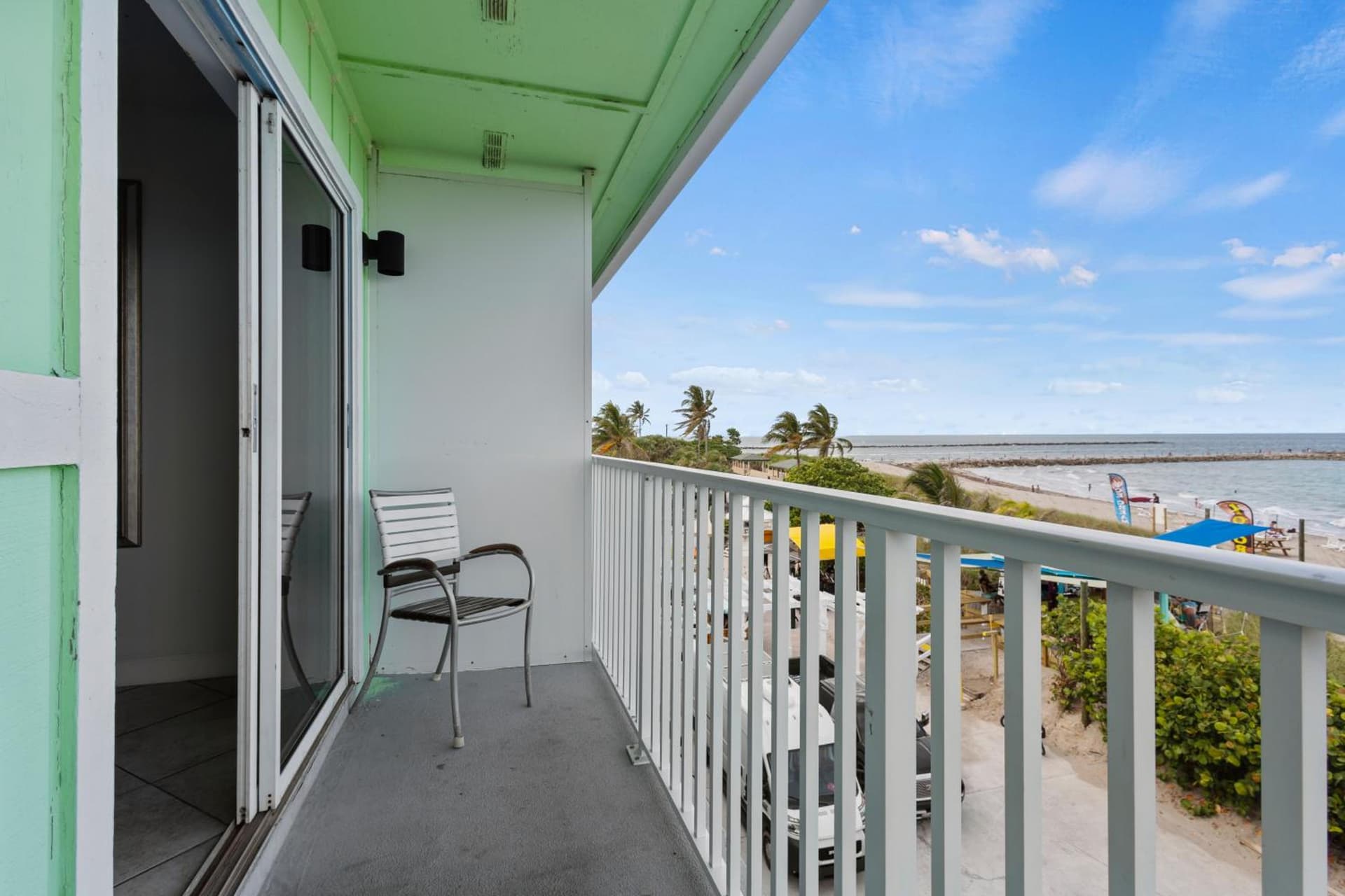 Ocean View Hotel Room with Balcony- King Bed #25 interior in Fort Pierce, FL — gallery photo 2