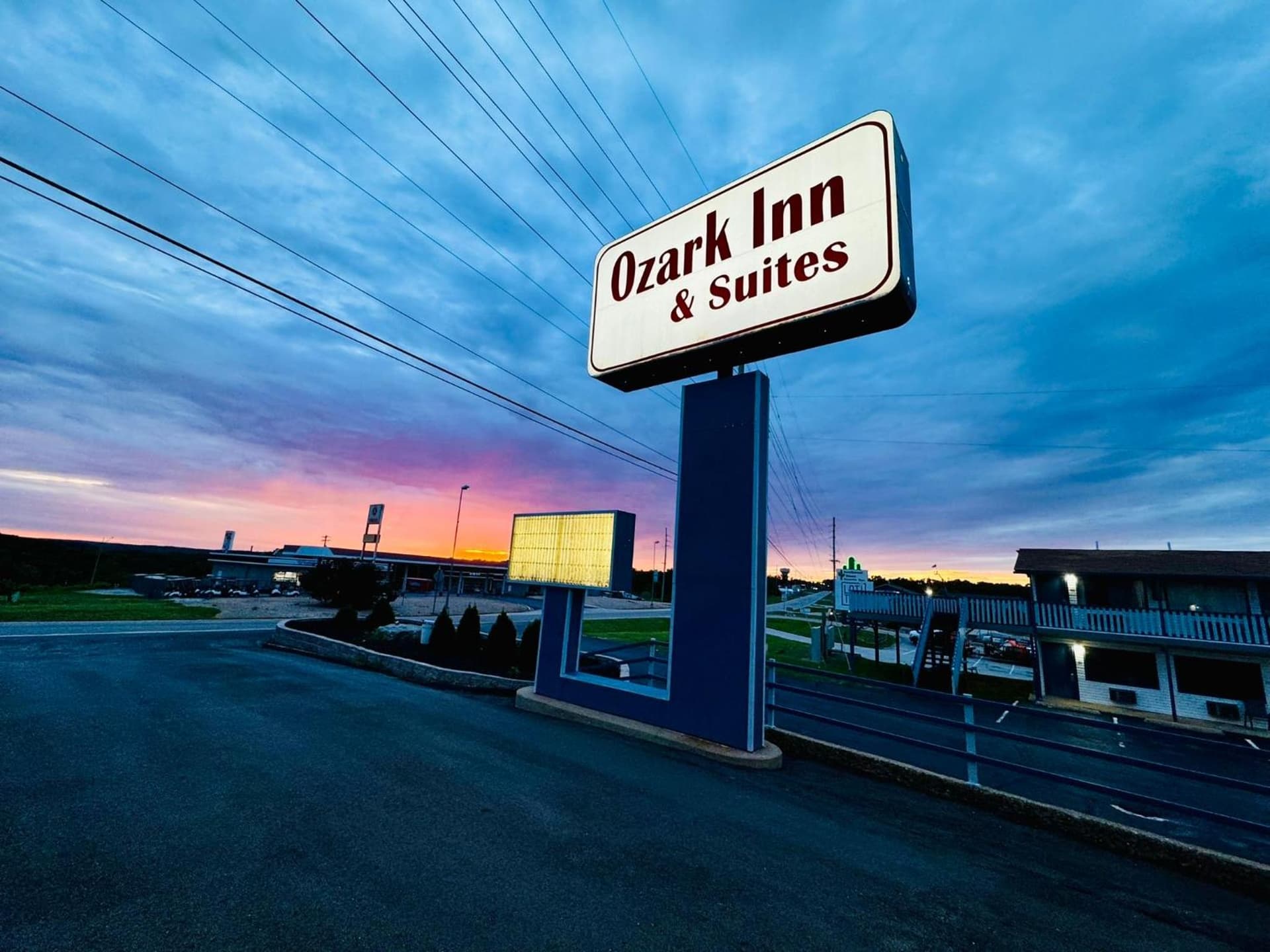Ozark Inn and Suites featured exterior or lobby in Osage Beach, MO — similar hotel