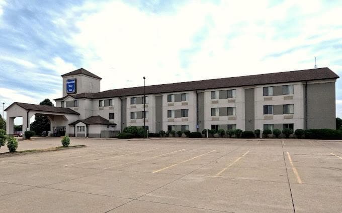 Pleasant Stay Inn & Suites featured exterior or lobby in Carnforth, IA — similar hotel