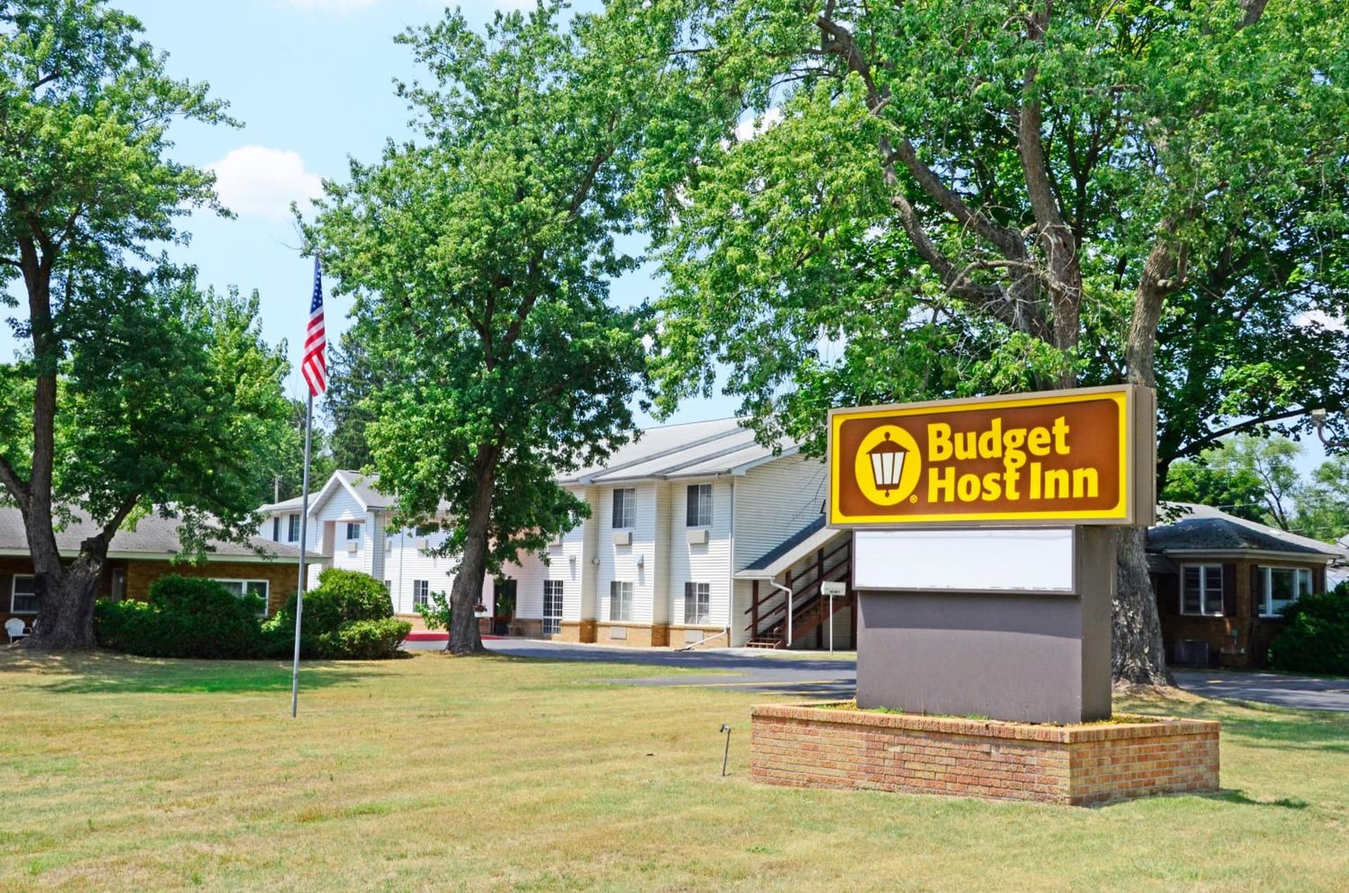 Budget Host Inn featured exterior or lobby in Allegan, MI — similar hotel