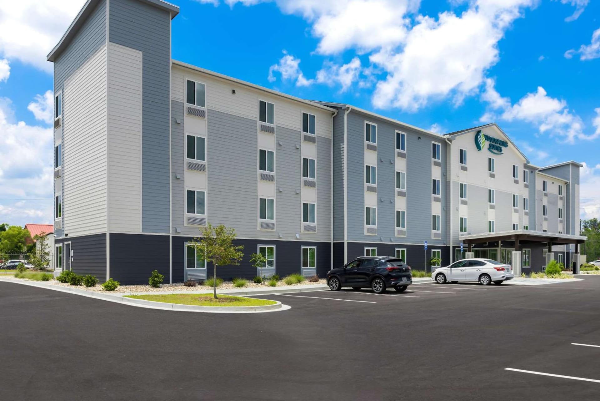 WoodSpring Suites Savannah West Chatham Parkway featured exterior or lobby in Savannah, GA — similar hotel