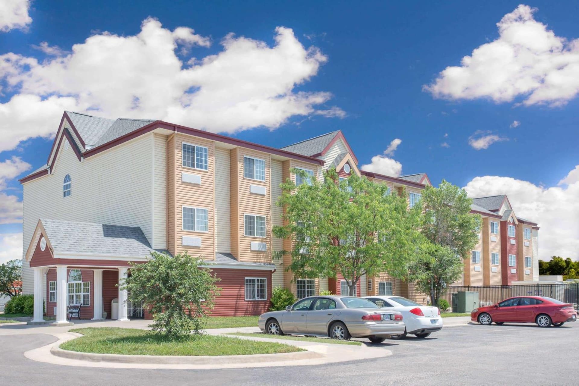Days Inn & Suites by Wyndham Hutchinson featured exterior or lobby in Hutchinson, KS — similar hotel