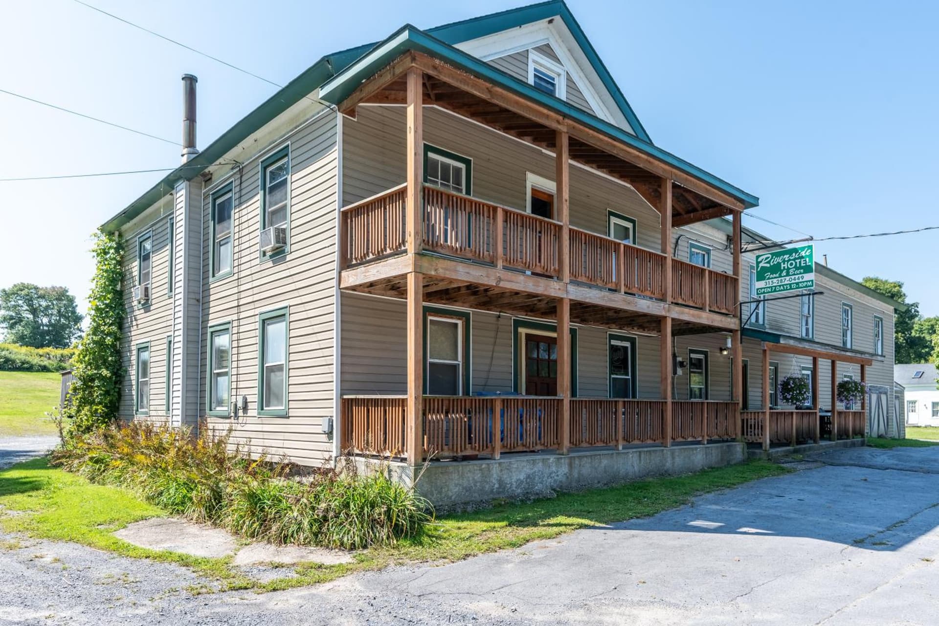 Riverside Hotel featured exterior or lobby in Gouverneur — similar hotel