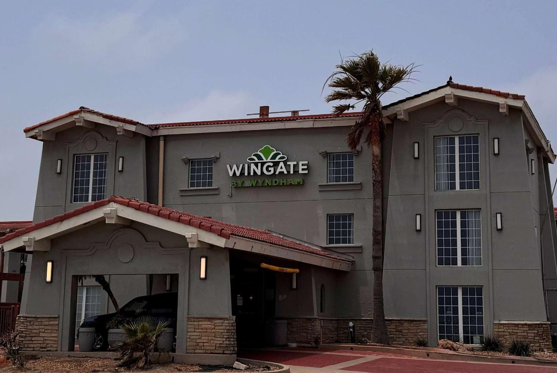 Wingate by Wyndham Galveston Beachfront at the Seawall featured exterior or lobby in Galveston, TX — similar hotel