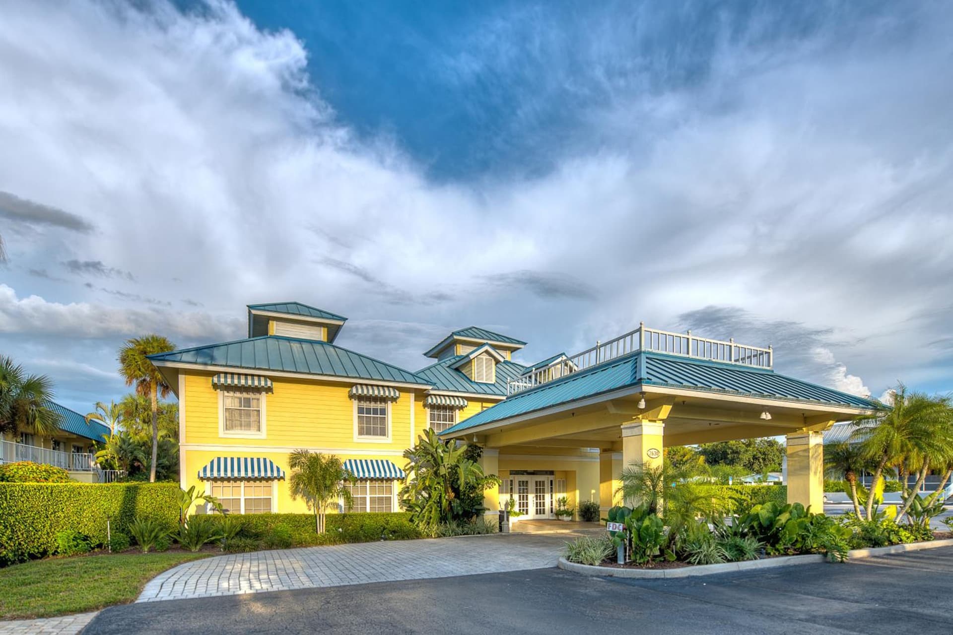 Naples Garden Inn featured exterior or lobby in Naples, FL — similar hotel