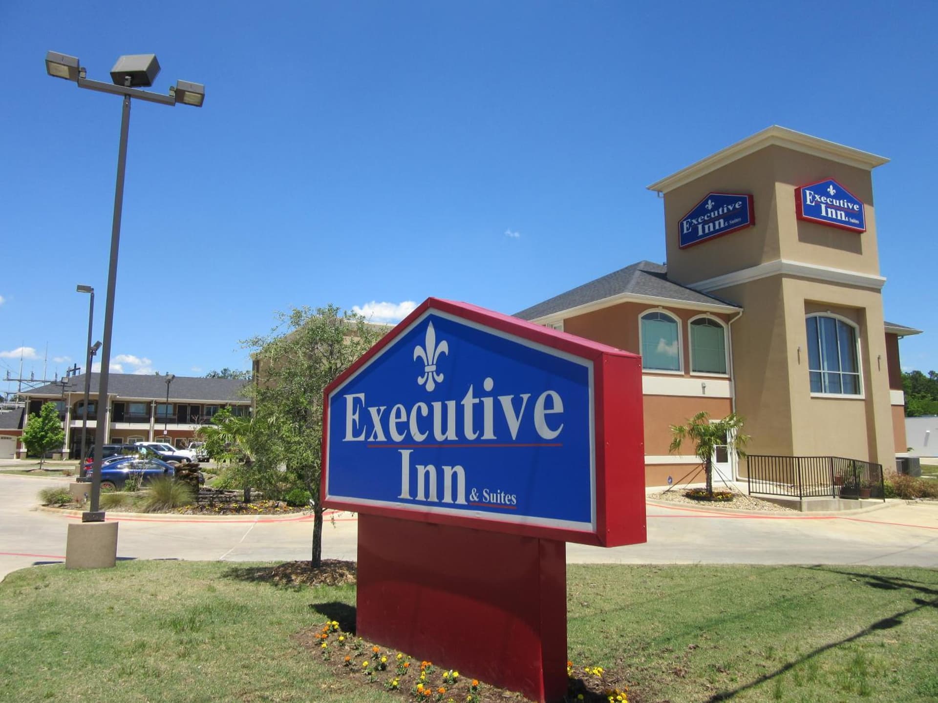 Executive Inn and Suites Tyler featured exterior or lobby in Tyler, TX — similar hotel