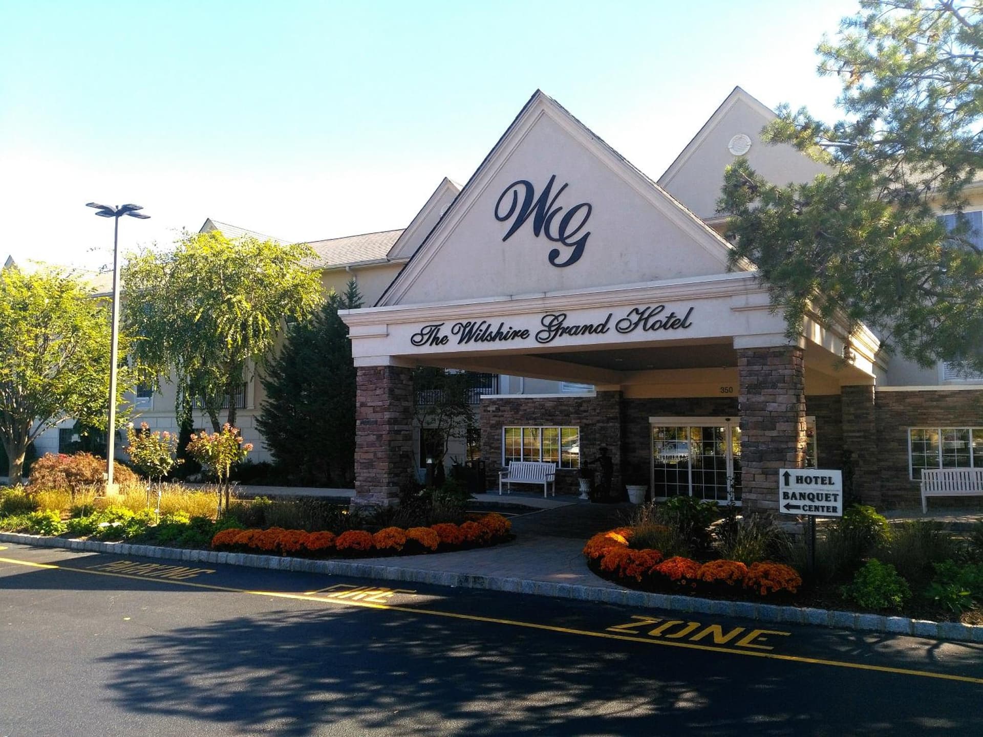 The Wilshire Grand Hotel featured exterior or lobby in West Orange, NJ — similar hotel