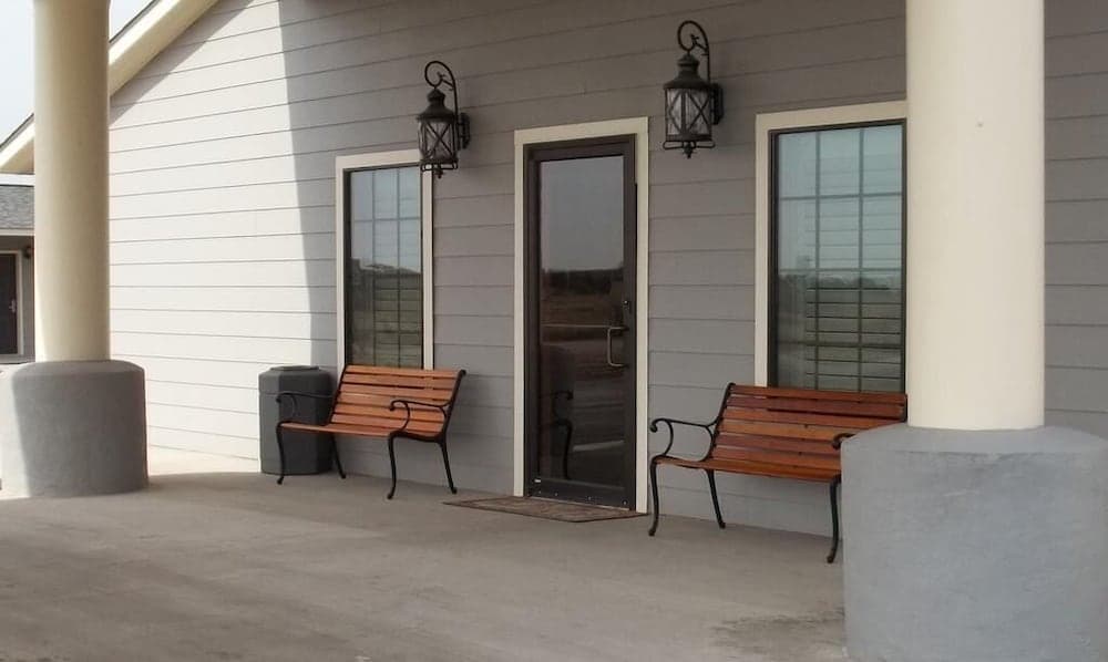 Southern Inn & Suites featured exterior or lobby in Yorktown, TX — similar hotel