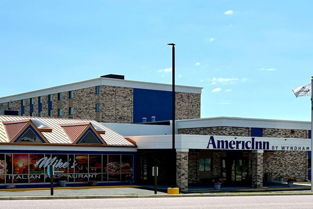 AmericInn & Suites By Wyndham Baraboo Event Center featured exterior or lobby in Baraboo, WI — similar hotel