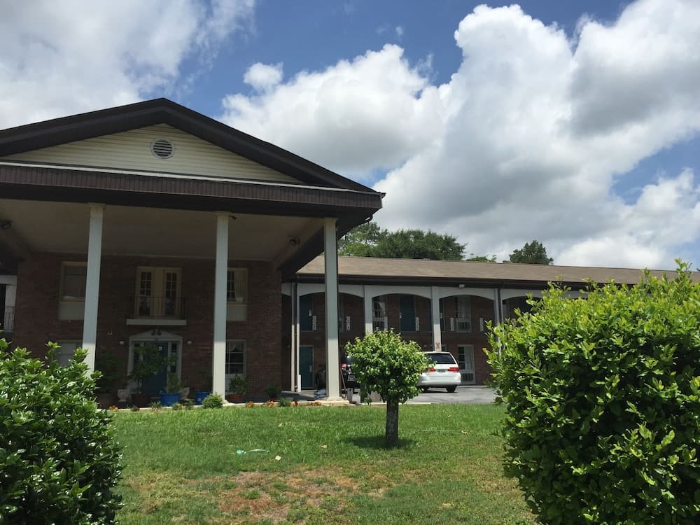 Scottish Inn & Suites featured exterior or lobby in Perry, GA — similar hotel