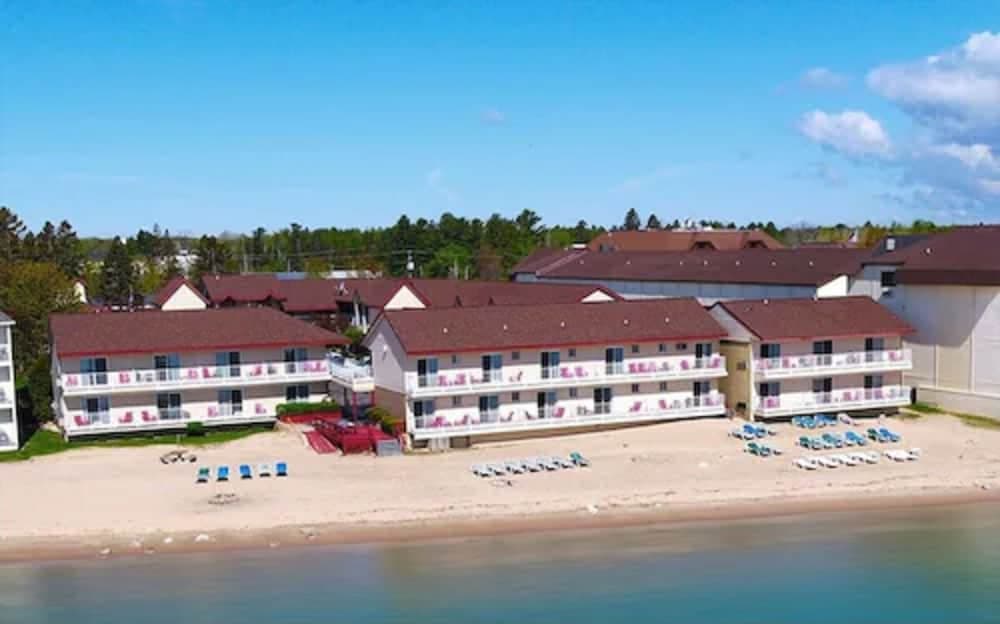 Super 8 by Wyndham Mackinaw City/Beachfront Area featured exterior or lobby in Mackinaw City, MI — similar hotel