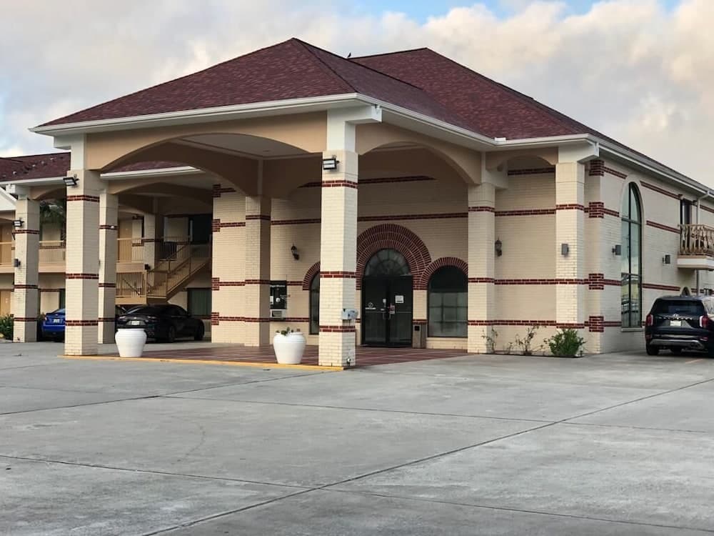 Executive Inn And Suites featured exterior or lobby in Porter, TX — similar hotel