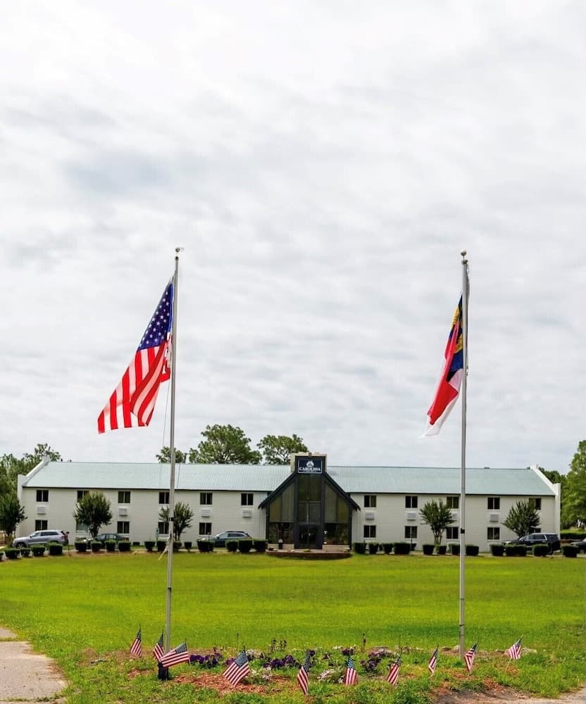 Carolina Pine Inn featured exterior or lobby in Pinebluff, NC — similar hotel