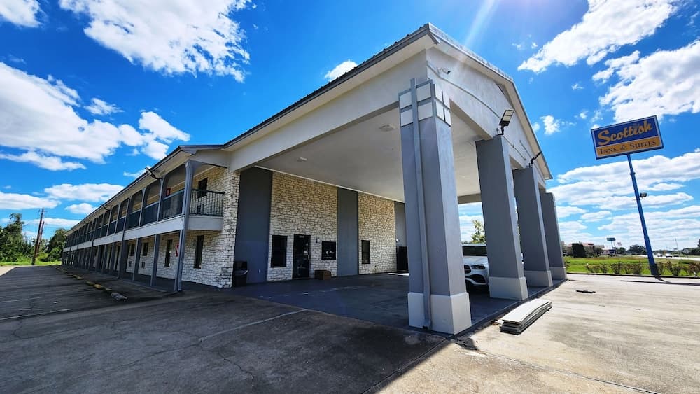 Scottish Inn & Suites featured exterior or lobby in Wharton, TX — similar hotel
