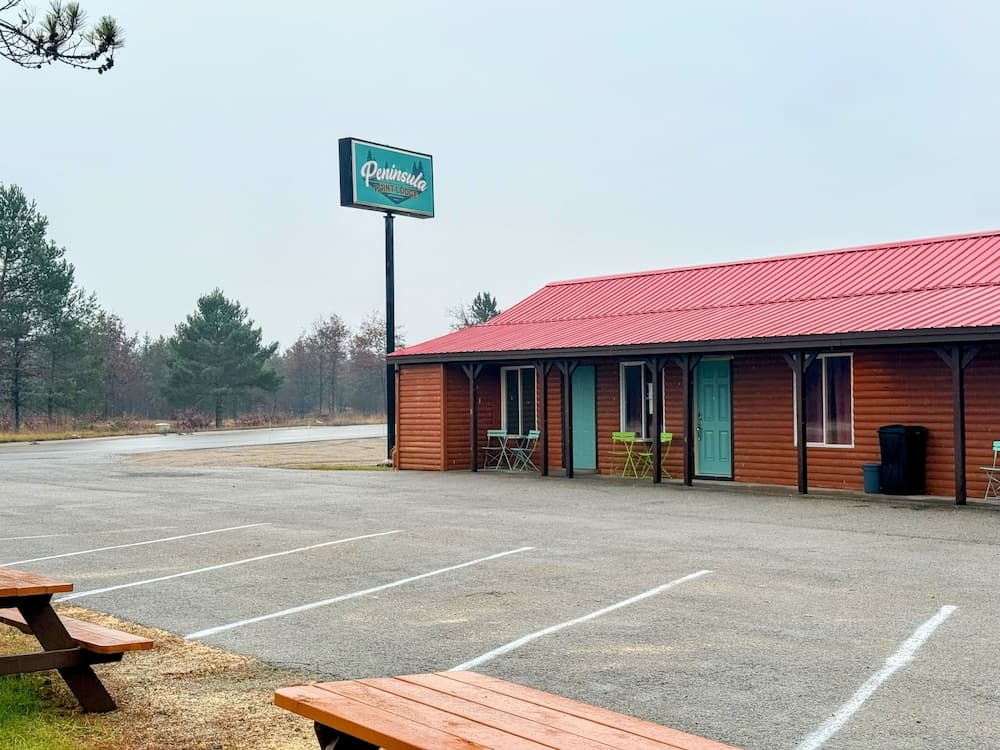 Peninsula Point Lodge featured exterior or lobby in Rapid River, MI — similar hotel