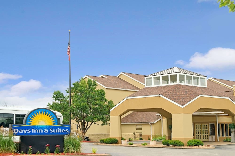 Days Inn and Suites by Wyndham St. Louis/Westport Plaza featured exterior or lobby in Maryland Heights, MO — similar hotel