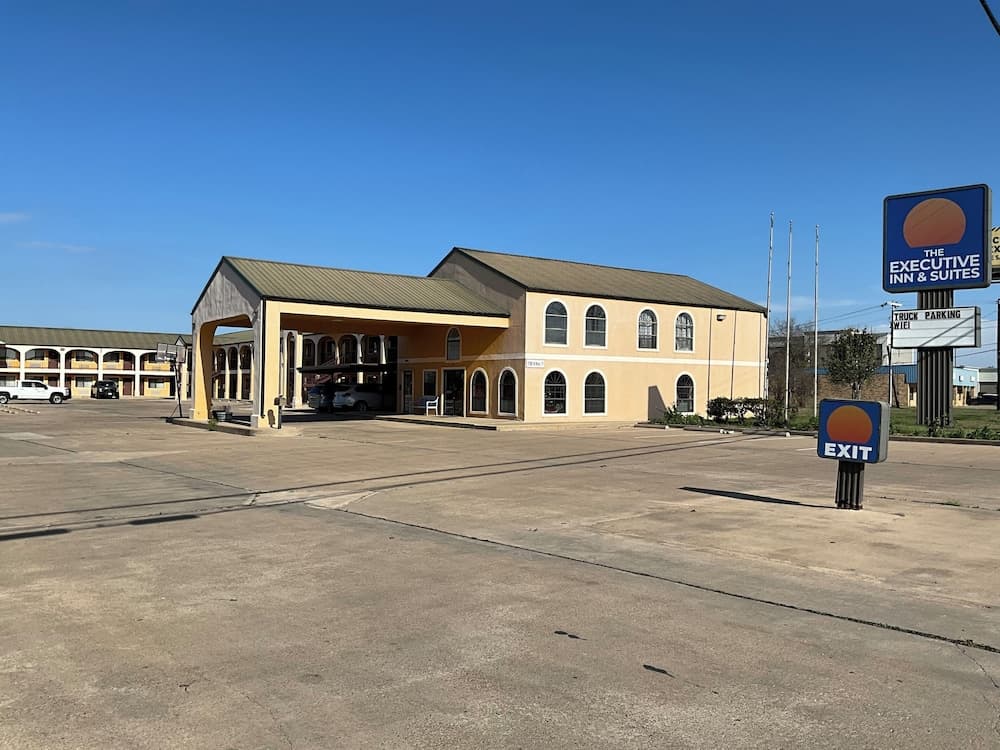 Executive inn & Suites featured exterior or lobby in La Grange, TX — similar hotel