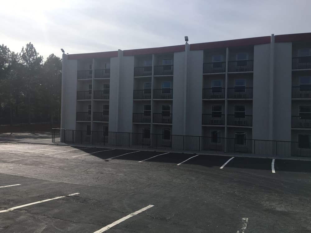 Peachtree Inn & suites featured exterior or lobby in Doraville, GA — similar hotel
