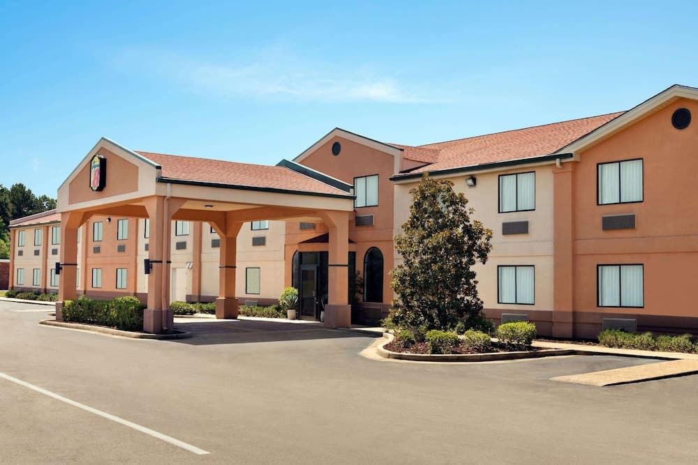 Super 8 by Wyndham Clinton featured exterior or lobby in Clinton, MS — similar hotel