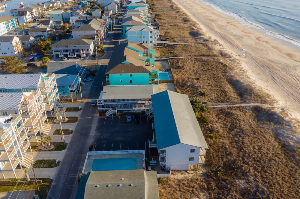 The Beach House featured exterior or lobby in Carolina Beach, NC — similar hotel