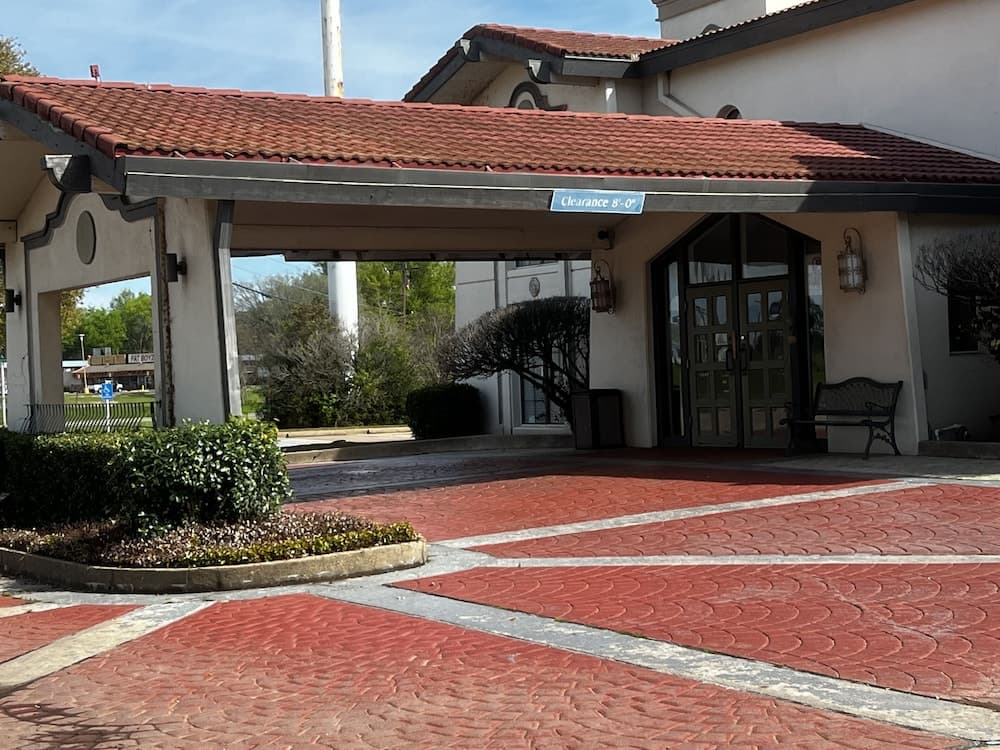 Relax Inn & Suite featured exterior or lobby in Longview, TX — similar hotel