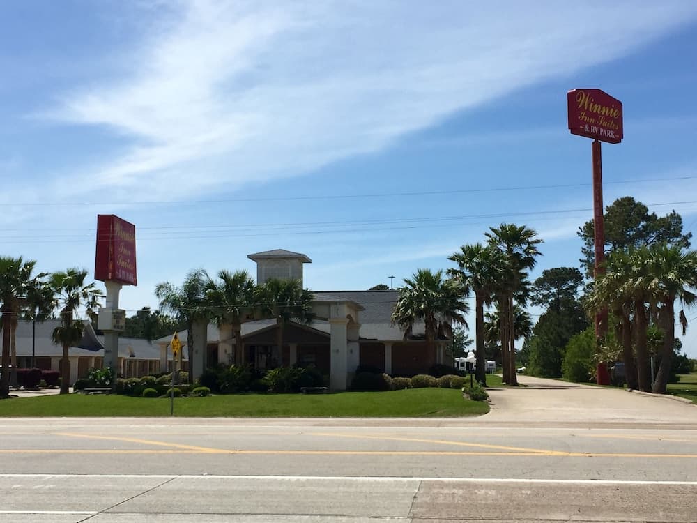 Winnie Inn Suites & RV Park featured exterior or lobby in Winnie, TX — similar hotel
