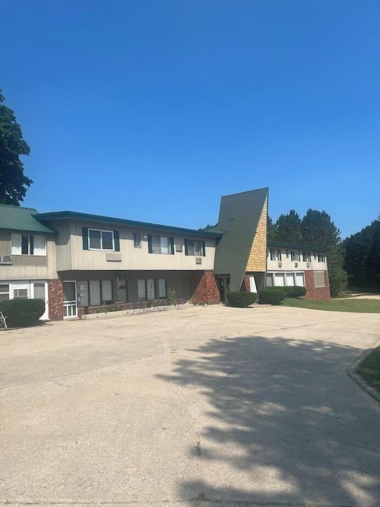 Lost Pines Lodge featured exterior or lobby in Harrietta, MI — similar hotel