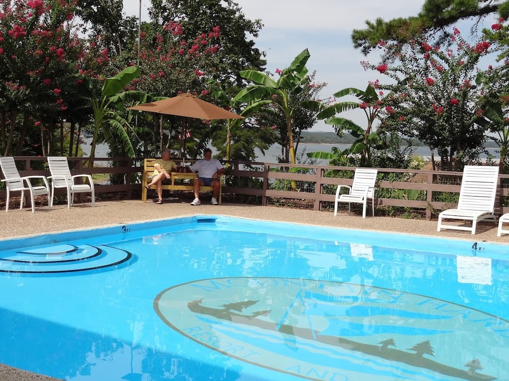 Poolside King Cabana with full kitchen, king bed, sleeper sofa and pool access. by RedAwning — hotel in Mount Ida, Arkansas